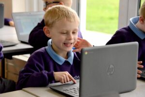 Pupil working on a laptop computer